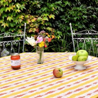 Nappe enduite anti tache ronde ou ovale ikat jaune curry par la marque Fleur de Soleil Fleur de Soleil - Nappe enduite anti tache ronde ou ovale ikat jaune curry