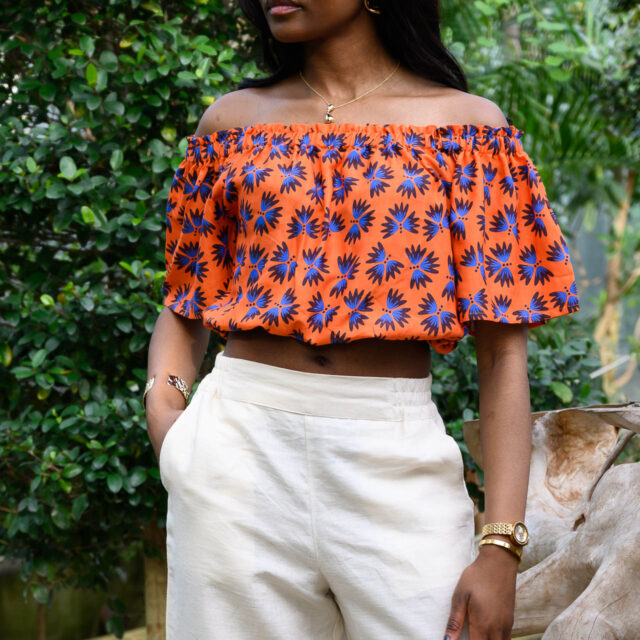 Nevice - Top epaule denude orange fleurie