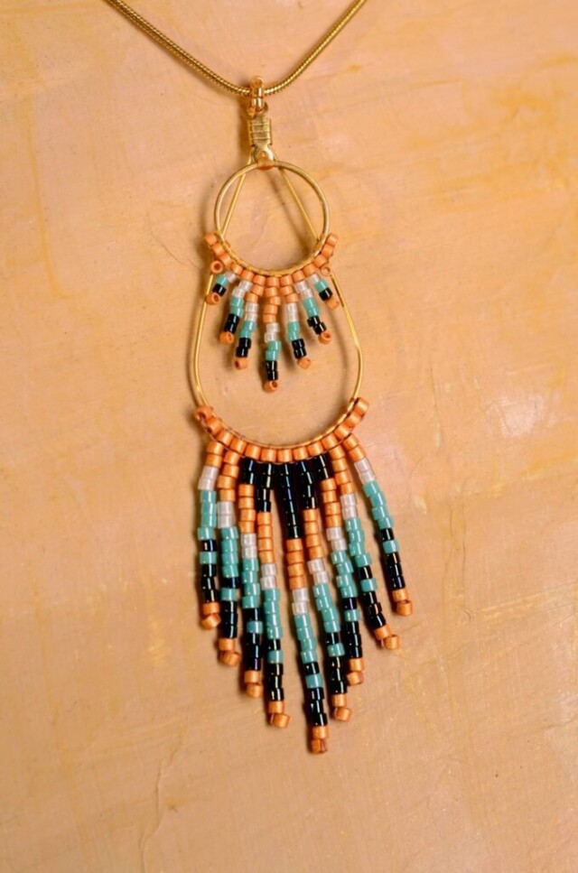 valdyria.com - Collier à Pendentif Nilyra Maria Bronze
