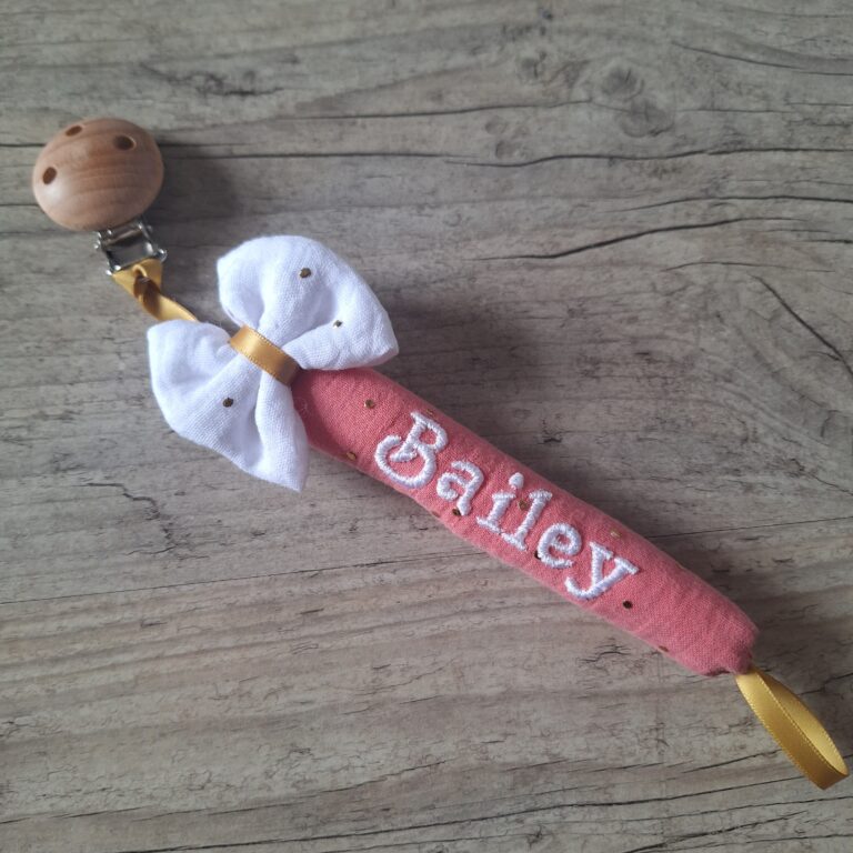 La Fabrique A DeDeuh - Attache tétine nœud personnalisée – Tube moelleux façon doudou avec prénom brodé - en gaze de coton pois or